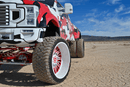 Ford F450 truck with large wheels on a desert landscape Predator - New Mutant X-MT Range