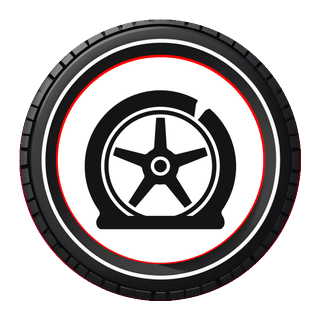 A flat tyre sitting on its rim