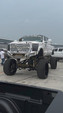 Video showing New Mutant X-MT- on a F350 with high suspension on display then close up on tyres